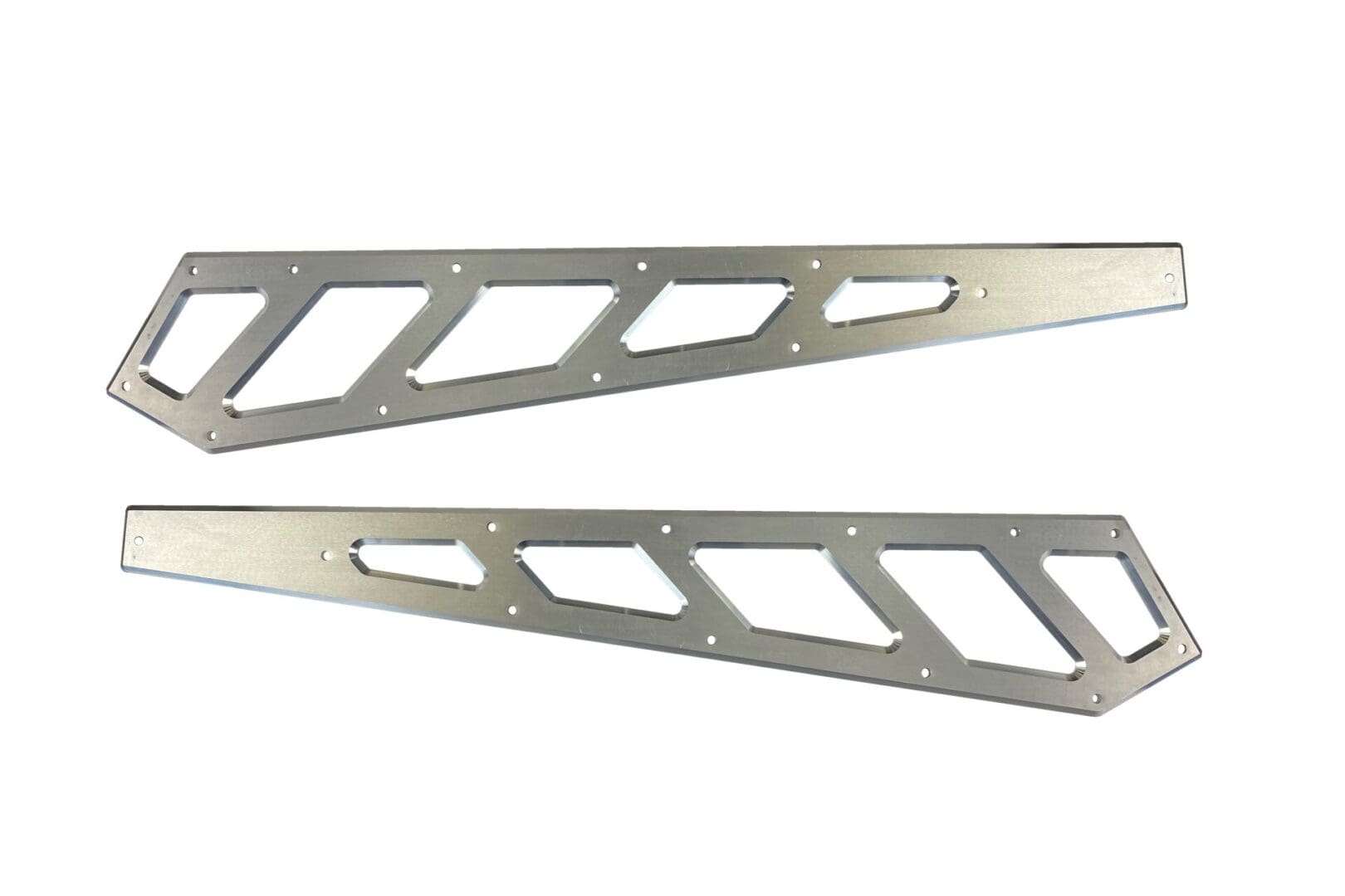 A pair of metal triangles with holes in them.