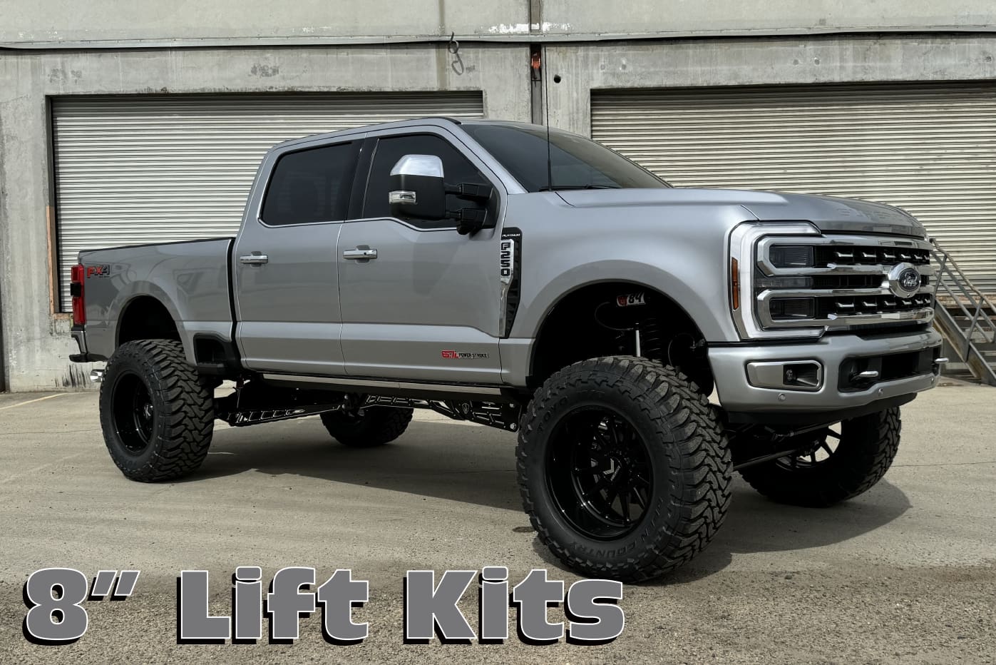 Silver Ford F250 with 8" lift kit.